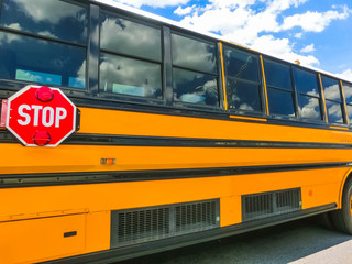 The traditional school buss on freeway road at Orlando, Florida, USA