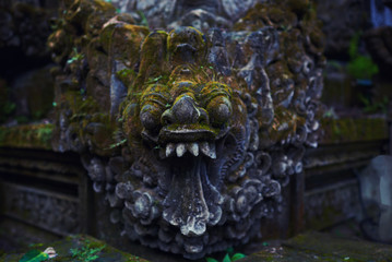 Beautiful view of ancient stone carving of temple on Bali island. Gunung Kawi Temple and Candi in jungle at Bali, Indonesia. Old temples in the jungle. Ancient temple ruins. Carved in stone temple.