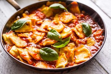 Italian or mediterranean food pasta ravioli of tomato sauce.