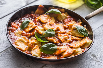 Italian or mediterranean food pasta ravioli of tomato sauce.
