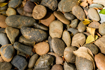 Pebble stones for background texture top view