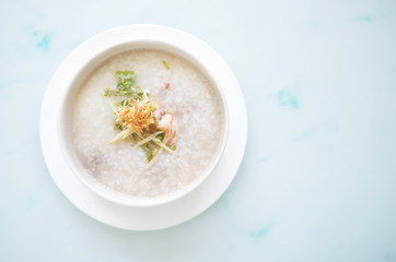 porridge rice with shrimp in white bowl. top view photo