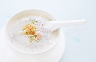 porridge rice with shrimp in white bowl. top view photo
