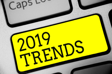 Text sign showing 2019 Trends. Conceptual photo things that is famous for short period of time in current year Keyboard yellow key Intention create computer computing reflection document.