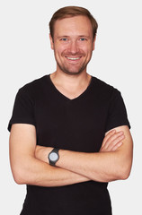 Happy casual bearded man in black t-shirt