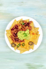Nachos with cheese and chilli, traditional Mexican snack, with place for text