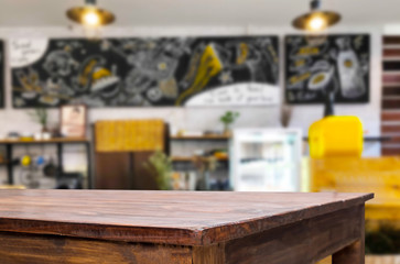 Naklejka na ściany i meble Selected focus empty brown wooden table and Coffee shop or restaurant blur background with bokeh image. for your photomontage or product display