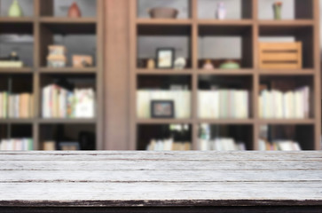 Wooden board empty table space platform in front of blurred library Of The background - can be used for display or montage your products. Mock up for display of product.