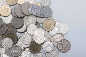 Thai coin currency baht used for cash in Thailand. Many coin on the white background 