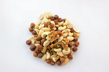 Mixture hazelnuts almonds walnuts cashews on pile