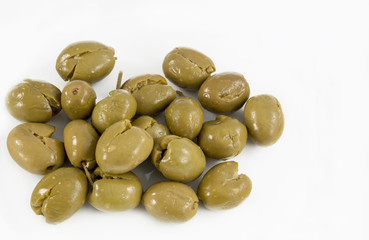 Green olives on white background