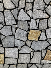 Stone wall with black veins. Texture, background