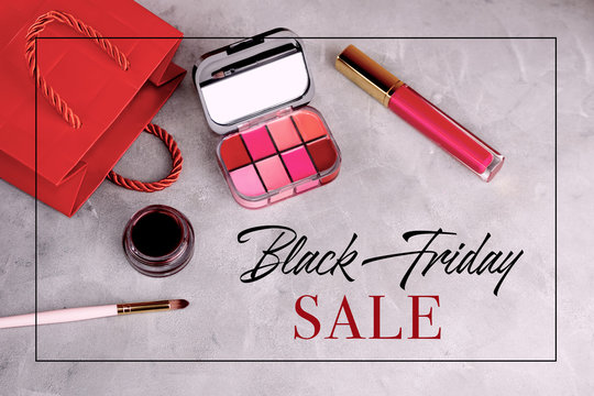 Flat lay top view black friday background with cosmetics and red paper bag