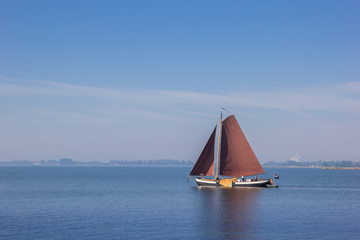 Old wooden sailing boat on the Ijsselmeer near Hoorn, Netherlands