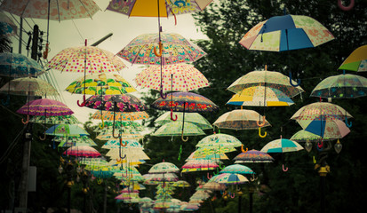 Decorative fashion colorful umbrellas on the sky background