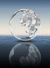 Togo on translucent globe above water