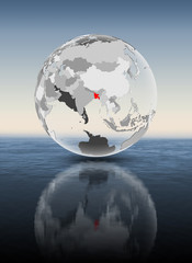 Bangladesh on translucent globe above water