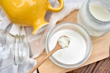 Kefir milk, Close up of hand holding kefir grains, Healthy fermented food, Probiotic nutrition drink for good balance digestive system.