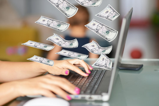 Working From Home Mom With Flying Money Above The Computer And Small Child Playing Around