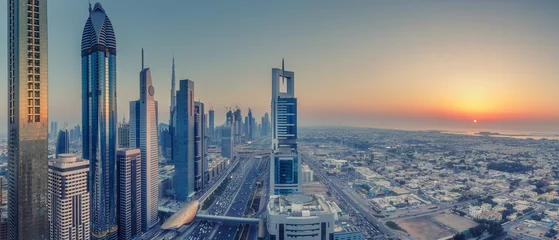 Fototapete Rund Nahen Osten Skyscrapers and highways of a big modern city at sunset. Aerial panoramic view on downtown Dubai, United Arab Emirates.  © Funny Studio