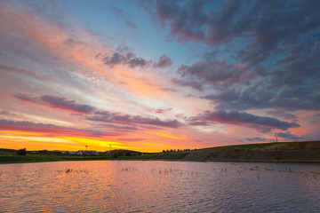 Fototapeta na wymiar Amazing sunset over the pond in Poland