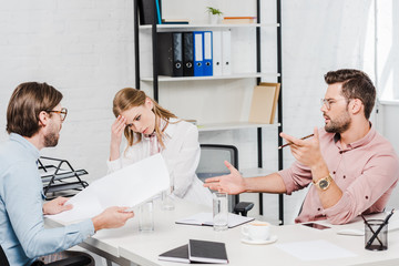 Fototapeta premium team of confident business partners having conversation at conference room of modern office
