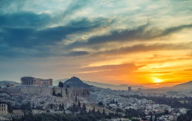 Fotobehang View on Acropolis in Athens, Greece, at sunrise. Scenic travel background with dramatic sky. © Funny Studio