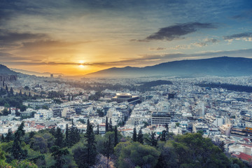 Panorama view on Athens, Greece, at sunrise. Scenic travel background with dramatic sky.