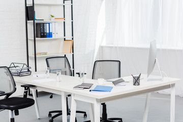 interior of empty office with computer on desk