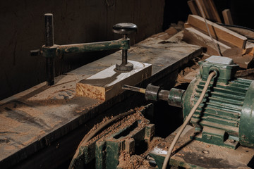close up view of woodworkers workplace with equipment and wood at workshop