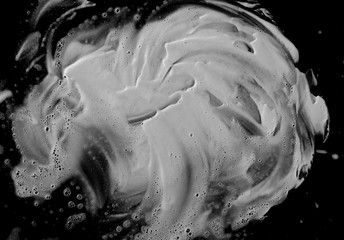 Salt crystal pile isolated on black background, top view