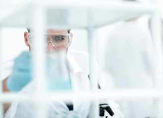 closeup.male chemist on blurred background laboratory