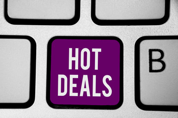 Writing note showing Hot Deals. Business photo showcasing An agreement through which one of the paties is offered and accept Keyboard purple key Intention computer computing reflection document.