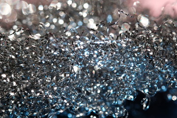 Shiny serpentine tinsel close up with blured background