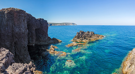 Fototapeta na wymiar Rock formations on the cliffs of the island of San Pietro in Sardinia, Italy.