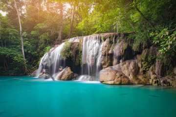 Fototapeta na wymiar Erawan waterfall in tropical forest, Thailand 