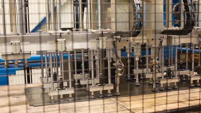 Equipment for moving metal sheets in the working space. Scene. Modern machines for sheet metal processing