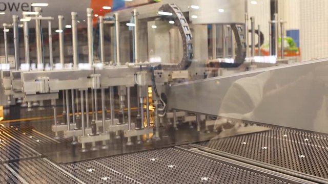 Equipment for moving metal sheets in the working space. Scene. Modern machines for sheet metal processing
