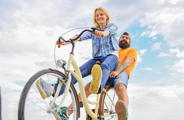 Bike rental or bike hire for short periods of time. Couple with bicycle romantic date sky background. Couple in love date cycling. Explore city. Man and woman rent bike to discover city as tourist