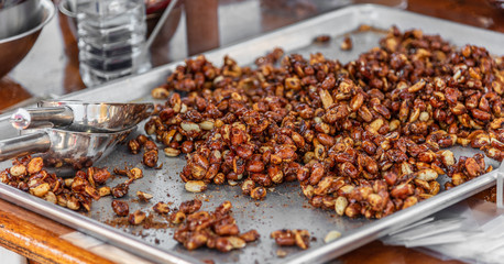 A tray of roasted nuts is for sale on a street vendors stall in the city of Melbourne, Australia