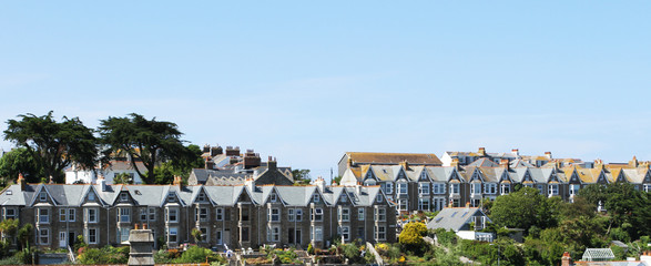 Seaside Village of St. Ives, Cornwall, UK. View over old town with typical houses in afternoon...