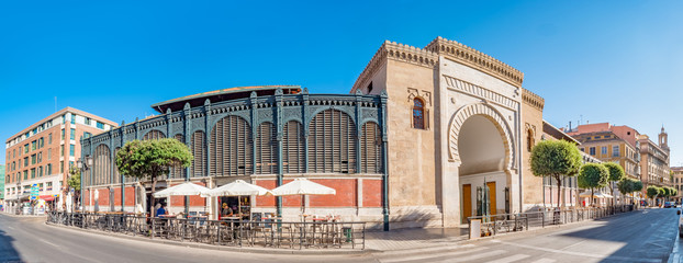 Panorama view of the Arabic marble arch, entrance of the Atarazanas food market in the historic centre of the city of Malaga, Spain