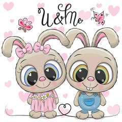 Fototapeta premium Rabbits boy and girl on a hearts background
