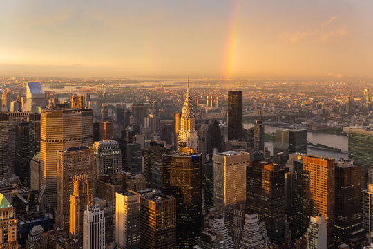 Skyscrapers at midtown New York City with the East River on the background at dramatic after the storm sunset light, USA.
