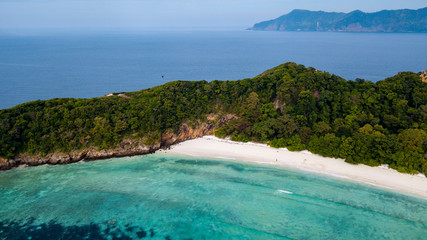 Aerial drone view of a long sandy beach on a beautiful tropical island in the Mergui Archipelago, Myanmar