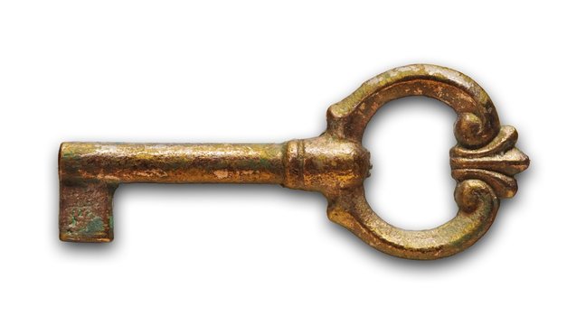 old metal key isolated on the white background with soft shadow
