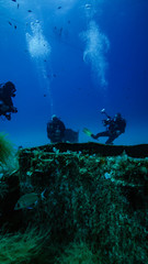 Three divers amidships on the wreck