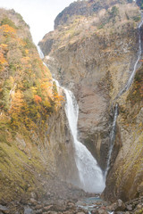 Fototapeta na wymiar Japanese waterfall, Autumn Shomyo Falls in Toyama. 日本の滝　秋の称名滝　富山県立山町