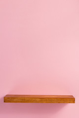 woden shelf at abstract wall background