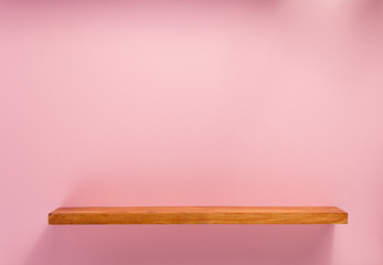 woden shelf at abstract wall background